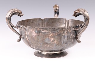 A silver 3 handled bowl, the handles in the form of sea creatures raised a circular spreading base, Sheffield 1911 by E Wigfull (Henry Wigfull) 12cm h, 1400 grams 