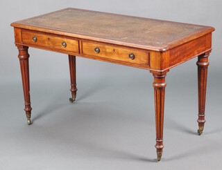 A Victorian mahogany writing table with brown leather writing surface, fitted 2 frieze drawers, raised on turned and fluted supports 73cm h x 121cm w x 60cm d  