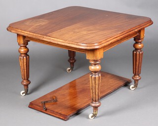 A Victorian mahogany extending dining table, raised on turned supports with ceramics caps and casters 70cm h x 101cm w x 102cm l x 146cm when extended (complete with winder)