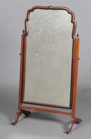 A Queen Anne style arched plate dressing table mirror contained in a shaped mahogany frame 102cm h x 52cm w x 34cm d (silvering to the mirror is showing signs of deterioration)