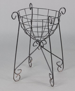 A circular black painted wirework planter 56cm h x 35cm diam