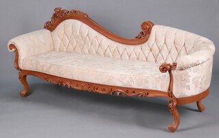 A pair of Victorian style show frame  carved and pierced hardwood sofas with upholstered seats and backs, raised on carved cabriole supports 88cm h x 222cm l x 75cm d (some slight stains in places, one has a small hole to the seat upholstery) 