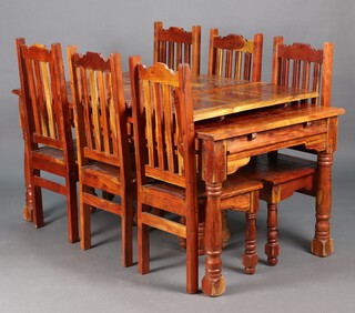 A rectangular hardwood dining suite, the table raised on turned supports with two side extensions  75cm h x 167cm w x 91cm d and six dining chairs