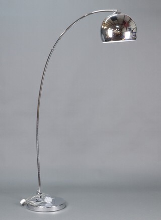 A polished chrome cantilever standard lamp on a circular base 