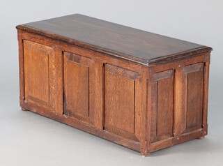 An oak and plywood coffer of panelled construction 44cm h x 97cm w x 42cm d