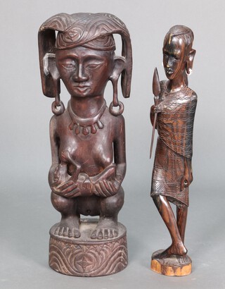 An African standing figure of a Masai warrior 62cm h and 1 other of a lady 64cm h 