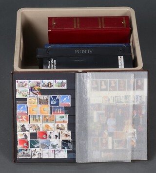 A ringbound album of Elizabeth II GB mint and used stamps, three stock books of GB mint and used stamps and an album of various First day covers
