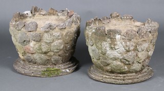 A pair of circular rustic style garden planters 37cm h x 46cm diam. (1 with damage to top) 