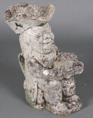 A well weathered concrete garden  figure in the form of a seated Toby Philpots 44cm 