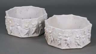 A pair of octagonal white glazed garden planters decorated cherubs 19cm h x 42cm diam