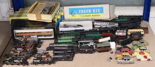 Twelve OO gauge electric engine motors together with various chassis and six Grafar railway carriages and a small collection of toy cars