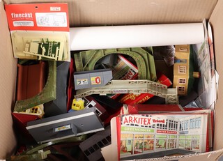 A collection of various plastic railway buildings etc contained in a cardboard box