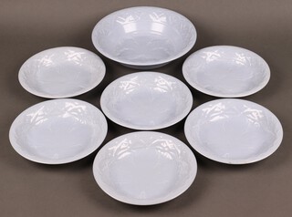 A seven piece blue glazed Poole pottery dessert service comprising circular serving bowl (chipped) and 6 bowls (3 chipped, 1 cracked and chipped)