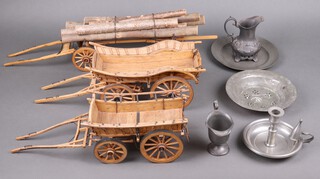 Three wooden model horse drawn wagons and five items of pewter