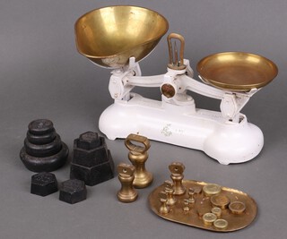 A pair of Libra iron and brass pan scales and a collection of weights