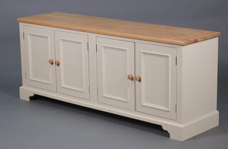 A Neptune oak and cream sideboard/dresser base fitted 2 cupboards with shelves, enclosed by panelled doors and raised on bracket feet  74h x 184w x 49d