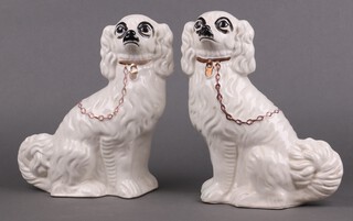 A pair of Staffordshire figures of seated dogs 27cm (1 cracked)