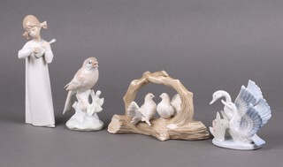 A Lladro figure of a standing girl with ukulele 20cm, together with three Spanish figures of birds