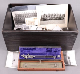 A collection of various military ephemera including a Stanley parallel rule, various black and white photographs etc 