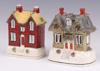 A 19th Century Staffordshire flat back money box in the form of a cottage and 1 other Staffordshire cottage 13cm h