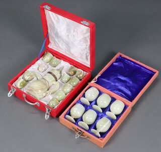 A Turkish 13 piece onyx coffee set comprising coffee pot (spout a/f) and 12 cups and a set of 6 turned onyx goblets, both contained in plush cases 