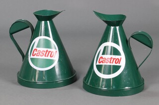 A pair of reproduction pressed metal waisted castrol oil jugs 32cm h 