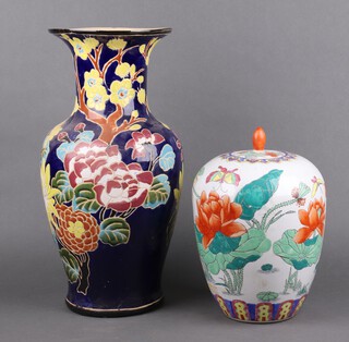 A Chinese style jar and cover with polychrome mounts 33cm h and a club shaped vase 50cm h
