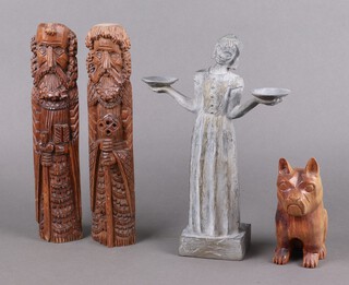Two carved wooden figures of Saints 34cm, a carved wooden figure of a seated bulldog 16cm, a resin figure of a standing lady 32cm