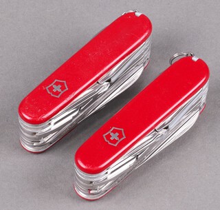 Two Champs Swiss Army pen knives