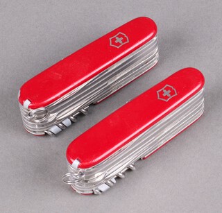 Two Champs Swiss Army pen knives 