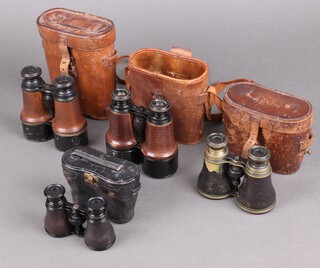 Lawrence and Mayo, a pair of War Office issue binoculars marked 2547 Line 1902 and with broad arrow stamp in a leather carrying case, Dollond, a pair of 5 x binoculars in a leather carrying case, a pair of opera glasses and one other pair of binoculars (cased) (4)