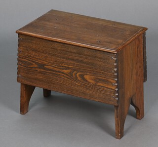 A rectangular oak stool/coffer of panelled construction with hinged lid 35cm h x 40cm w x 26cm d 