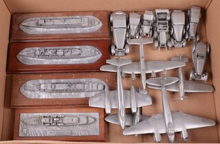 Four pewter models of ships, RMS Queen Mary, Queen Elizabeth, Queen Elizabeth II and HMY Britannia together with several pewter models of aircraft and motorcars 