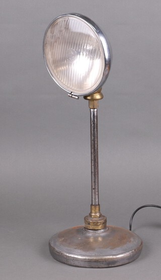 A table lamp made from a Lucas headlamp 56cm h 