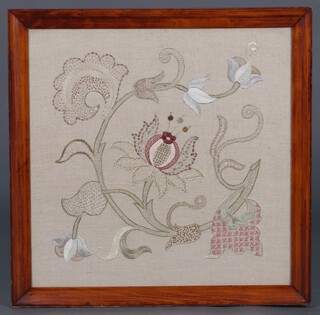 A floral embroidered panel contained in an oak frame, 58cm x 58cm