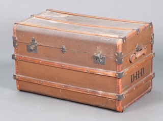 An Edwardian fibre, wooden and metal bound trunk with hinged lid 53cm h x 87cm w x 53cm d 