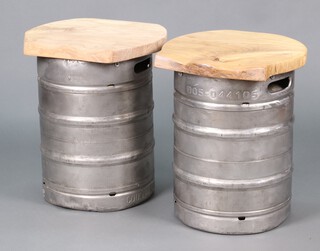 A pair of elm and aluminium bar stools formed from beer barrels 57h x 46w x 44d
