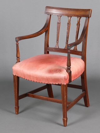 An Edwardian Georgian style mahogany stick and rail back carver/desk chair, seat upholstered in bleached red leather, on square tapered supports, spade feet 88cm h x 54cm w x 46cm d 
