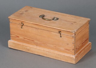 A 19th Century rectangular pine box with brass swan neck handle raised on a platform base 21cm h x 47cm w x 22cm d