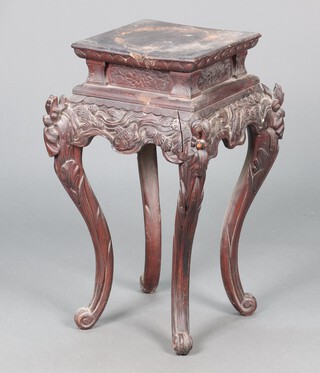 A Japanese carved ebonised jardiniere stand decorated with carp, raised on cabriole supports 64h x 29w x 30d - the frame is loose and requires attention