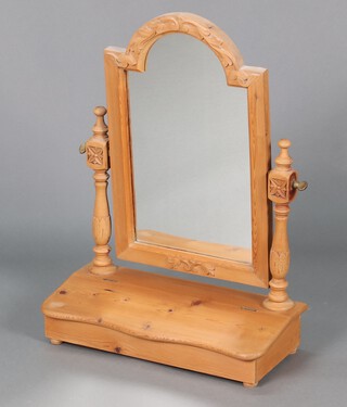A Victorian style arched plate dressing table mirror contained in a carved pine frame, the base fitted a box 68h x 50w x 23d