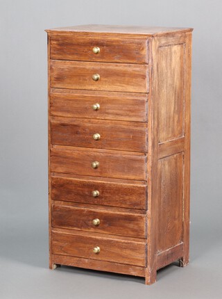 R L Milson of Fleet Street, an oak pedestal chest of eight shallow drawers with brass handles 108h x 53w x 39d