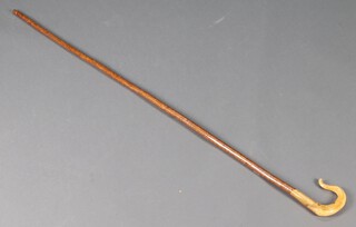 A shepherd's crook with ram's horn crook 