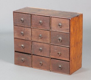 An 18th Century oak range of 12 shallow drawers with ring drop handles, 42cm h x 49cm w x 20cm d 