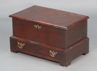 An 18th Century and later rectangular oak box/trunk with hinged lid and iron lock, the base fitted a drawer, raised on bracket feet 37cm h x 66cm w x 39cm d 