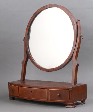 A 19th Century circular plate dressing table mirror contained in a mahogany swing frame on a bow front base fitted 3 drawers 48cm h x 44cm w x 16cm d 