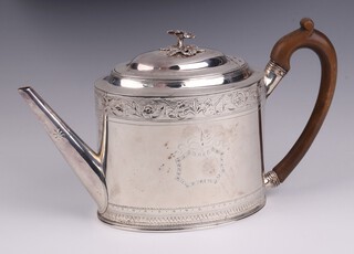 A George III oval engraved silver teapot with beech handle, London 1815 by Charles Fox, 15cm h, 465 grams  