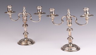 A pair of Queen Anne style filled silver candlesticks London 1980 and 1981 by Mills and Hersey, with associated twin branches London 1991, 22cm h, weighable silver (branches) 611 grams 