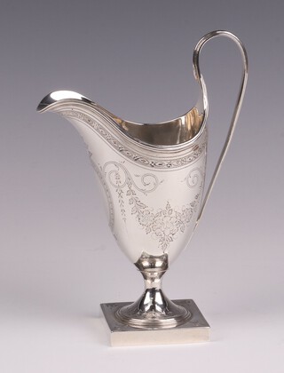 A George III engraved silver helmet shaped cream jug raised on a square foot, London 1789 by Hester Bateman, 13cm h, 119 grams 