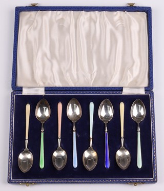 A cased set of 6 silver and enamelled coffee spoons Birmingham 1953 by Henry Clifford Davies, 110 grams 